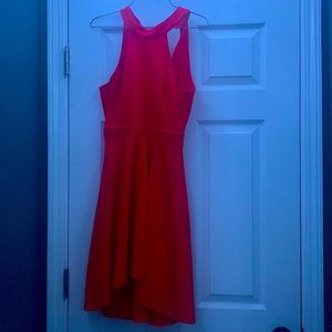 A Beautiful red dress. Shows half of your back. And fits great. Has never worn.